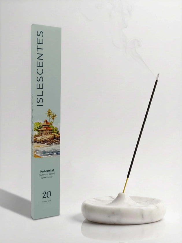Islescentes Potential Sunburst Scent Luxury Incense Sticks in mint green packaging with smoldering stick on marble holder