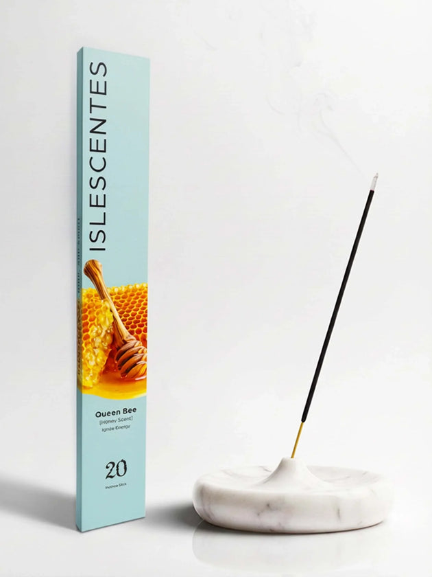 Islescentes Queen Bee Honey Scent Luxury Incense Sticks in mint green packaging with smoldering stick on marble holder